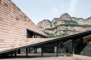 Sculptural sloping roof was added to an art museum in China to help it merge into the mountainside